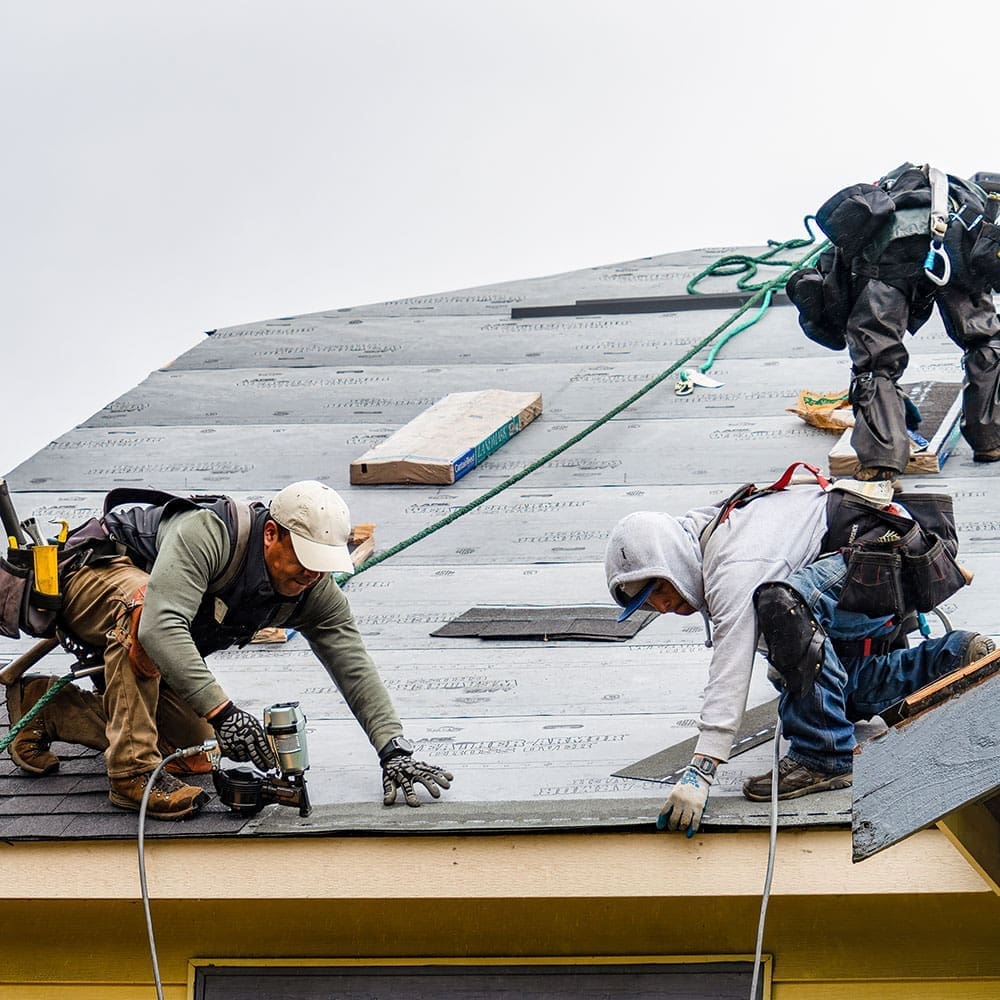 construction-intro Wayne Craft contractors working on a residential awning in Metro Detroit.